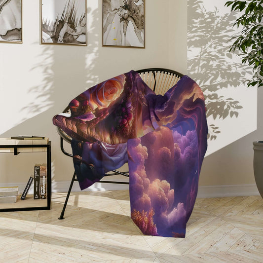 Velveteen microfiber blanket featuring vibrant clouds and an ethereal design, draped over a modern chair in a cozy setting.